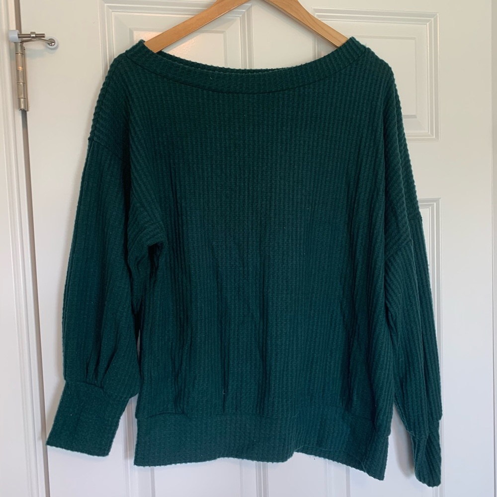 Woman’s off the shoulder sweater